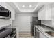 Sleek kitchen with stainless steel appliances, granite countertops, and ample cabinet space at 500 Newell Hill Rd # 113A, Leesburg, FL 34748