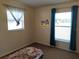 Cozy bedroom with carpet floors, natural light, and ample closet space at 509 Dorothy Cir, Eustis, FL 32726