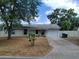 Charming single-story home with a well-maintained front yard and an attached one-car garage at 509 Dorothy Cir, Eustis, FL 32726