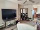 Cozy living room area showcasing tile floors, and entry into kitchen at 509 Dorothy Cir, Eustis, FL 32726