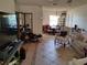 Inviting living room with tile floors, ample natural light, and seamless connection to the dining area at 509 Dorothy Cir, Eustis, FL 32726