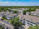 Aerial view of the residential community, featuring well-maintained buildings, parking, and mature trees at 5144 City St # 211, Orlando, FL 32839