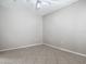 Neutral bedroom featuring tiled floors, ceiling fan, and natural light ready for customization at 5144 City St # 211, Orlando, FL 32839