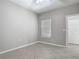 Neutrally decorated bedroom with tiled floors, a window, and closet for ample storage at 5144 City St # 211, Orlando, FL 32839