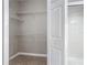 Empty closet with tile flooring and wire shelving offering space for storage and organization at 5144 City St # 211, Orlando, FL 32839