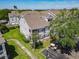 Exterior angle showing a well maintained condo with mature trees and landscaping at 5144 City St # 211, Orlando, FL 32839