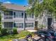 Charming condo with a screened balcony, lush greenery and parking spaces at 5144 City St # 211, Orlando, FL 32839