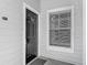 Close-up of a condo's front door with a 'welcome' sign and secure entry at 5144 City St # 211, Orlando, FL 32839