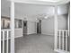 Bright, open living space featuring neutral paint, fan, and tiled floors ready for personalization at 5144 City St # 211, Orlando, FL 32839
