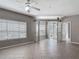 Open living space featuring tile floors, ample natural light, and neutral paint at 5144 City St # 211, Orlando, FL 32839