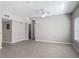 Open living room featuring neutral walls and floors, with plenty of natural light at 5144 City St # 211, Orlando, FL 32839