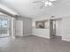 View of the living area, with tile flooring, an open layout to the kitchen at 5144 City St # 211, Orlando, FL 32839