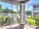 Screened-in patio offering views of the surrounding neighborhood and exterior building at 5144 City St # 211, Orlando, FL 32839