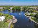 Overhead view of lake with water feature, gazebo, landscaping and walking path at 5144 City St # 211, Orlando, FL 32839