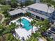 Aerial view of pool, lush landscaping, and outdoor amenities at 5144 City St # 211, Orlando, FL 32839