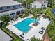 Pool with many chairs and tables for outdoor enjoyment at 5144 City St # 211, Orlando, FL 32839