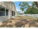 View of home's backyard, showing the lawn and perimeter fence at 558 Knollwood Dr, Davenport, FL 33837