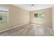 Comfortable bedroom features natural light, neutral paint, and wood-look flooring at 558 Knollwood Dr, Davenport, FL 33837