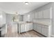 Open-concept kitchen features stainless steel appliances and a spacious breakfast bar at 558 Knollwood Dr, Davenport, FL 33837