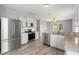 Modern kitchen boasts stainless steel appliances, granite countertops, and ample storage at 558 Knollwood Dr, Davenport, FL 33837