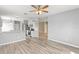 Open concept kitchen with white cabinets and stainless steel appliances at 558 Knollwood Dr, Davenport, FL 33837