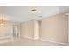 Open concept living room with beige walls and tile floors at 558 Knollwood Dr, Davenport, FL 33837