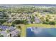 Expansive aerial view of a lakeside community featuring luxurious homes with private pools and lush green surroundings at 6313 Bordeaux Cir, Sanford, FL 32771