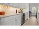 Elegant bar area featuring white cabinetry, marble countertops, wine rack, and beverage fridge, perfect for entertaining guests at 6313 Bordeaux Cir, Sanford, FL 32771