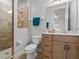 Updated bathroom featuring a tiled shower, vanity, and modern fixtures at 6313 Bordeaux Cir, Sanford, FL 32771