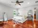 Bright and airy bedroom with hardwood floors, comfortable furnishings, and a peaceful ambiance at 6313 Bordeaux Cir, Sanford, FL 32771