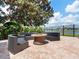 Outdoor fire pit area with stylish wicker seating, perfect for relaxing evenings by the waterfront at 6313 Bordeaux Cir, Sanford, FL 32771
