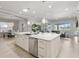 A spacious kitchen features a large island with a sink and stainless steel appliances at 6313 Bordeaux Cir, Sanford, FL 32771