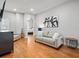 Cozy living room with hardwood floors, neutral tones, and stylish decor at 6313 Bordeaux Cir, Sanford, FL 32771
