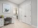 A home office featuring a built-in desk and view of the laundry room at 6313 Bordeaux Cir, Sanford, FL 32771