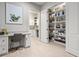 A home office featuring a built-in desk and view of the pantry at 6313 Bordeaux Cir, Sanford, FL 32771
