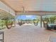 Inviting covered outdoor space featuring hanging hammock chairs and access to a private pool and waterfront view at 6313 Bordeaux Cir, Sanford, FL 32771