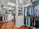 Well-organized walk-in closet with custom shelving, drawers, and ample hanging space for clothes and accessories at 6313 Bordeaux Cir, Sanford, FL 32771