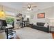 Bedroom with modern decor, ample lighting, and workspace at 652 Rochester St, Oviedo, FL 32765