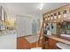 This bedroom features a loft bed with desk, white closet, and wood floors at 652 Rochester St, Oviedo, FL 32765