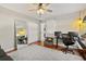 Bedroom features a ceiling fan, white trim, and a large full-length mirror at 652 Rochester St, Oviedo, FL 32765