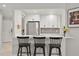 Kitchen bar area with stainless steel appliances and white cabinetry at 652 Rochester St, Oviedo, FL 32765