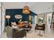 Stylish living room with high ceilings, unique lighting, comfortable seating, and a statement wall for a modern feel at 652 Rochester St, Oviedo, FL 32765