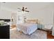 Bedroom with ceiling fan, spacious layout, and ensuite bath at 652 Rochester St, Oviedo, FL 32765