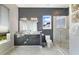 Sleek bathroom with a granite vanity, glass-enclosed shower, and modern fixtures at 748 Desert Mountain Ct, Reunion, FL 34747