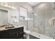 This bathroom features a modern glass-enclosed shower and sleek marble vanity at 748 Desert Mountain Ct, Reunion, FL 34747