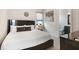 Comfortable bedroom featuring a queen-sized bed, private bathroom, and soft natural light at 748 Desert Mountain Ct, Reunion, FL 34747