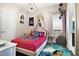 Themed bedroom with a bed, chandelier and decorative accents at 748 Desert Mountain Ct, Reunion, FL 34747
