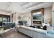 Bright open-concept living space boasts a fireplace, dining area, living room, and modern kitchen at 748 Desert Mountain Ct, Reunion, FL 34747