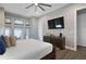 Elegant primary bedroom showcasing a plush bed, stylish decor, and ample natural light at 748 Desert Mountain Ct, Reunion, FL 34747