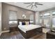 Elegant primary bedroom showcasing a plush bed, stylish decor, and ample natural light at 748 Desert Mountain Ct, Reunion, FL 34747